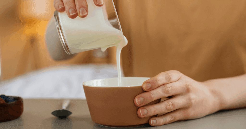 Powdered milk and condensed milk placed side by side on a Dubai kitchen counter