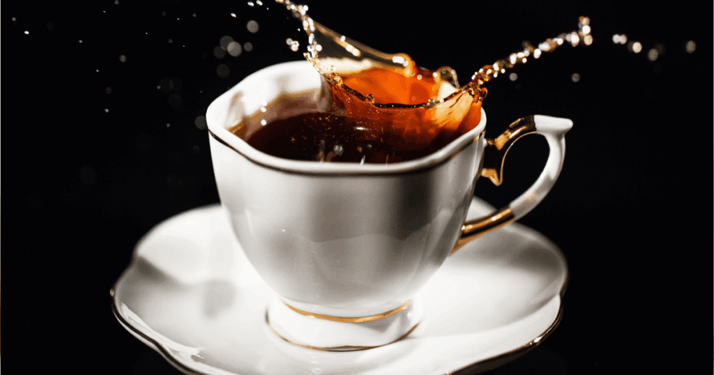 A cup of black tea next to skincare and haircare items available online at Grubss Dubai